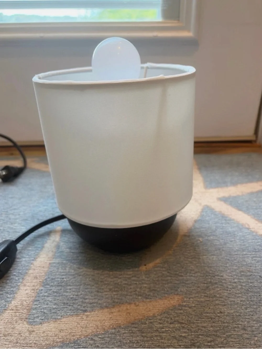 Brand new ikea table lamp with black base and white shade and light bulb